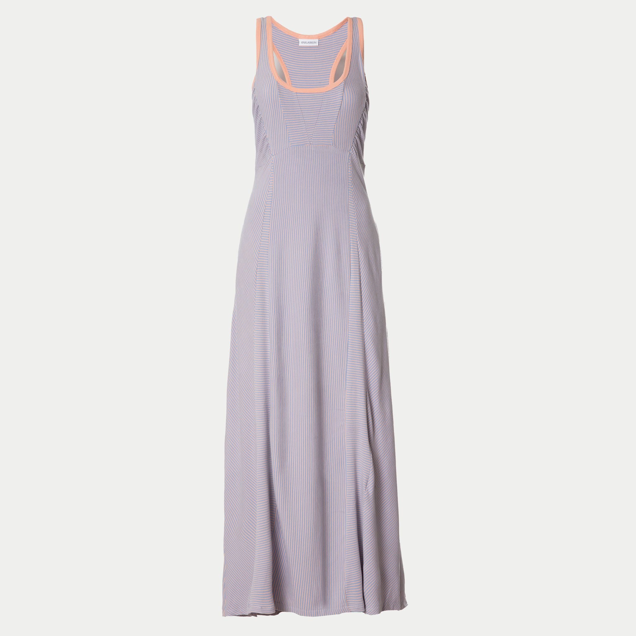 front view of the wingspan dress 2.0 in lilac by inlarkin showing the directional stripe detail, pockets and  empire top princess seams