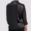 back view of the black aliferous shirt by inlarkin detailing the back flap of fabric and sheer sleeves