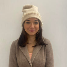  woman wearing the cashmere beanie in cream showing the frayed edge and versatility of the beanie