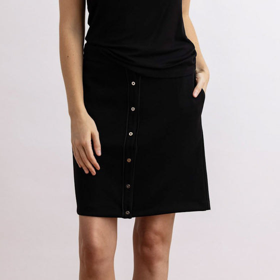 front view of the fly skirt by inlarkin showing the button front, pockets and comfort fabric