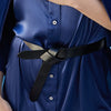 close up detail of the loop belt by inlarkin in black cinched at the waist 