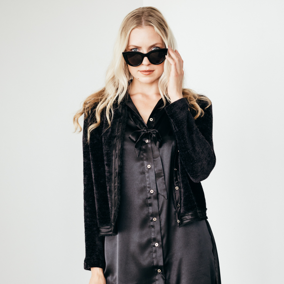  black button up mary sweater with frayed chiffon and sateen detail at the center front and hem by inlarkin