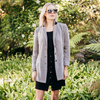 model wearing the sarah blazer by inlarkin in grey over a black fly skirt and black tank