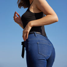 back view of the dark indigo stretch slimming denim jean, the unreal jean 2.0 by inlarkin, with contour waistband, regular rise, and front and back pockets