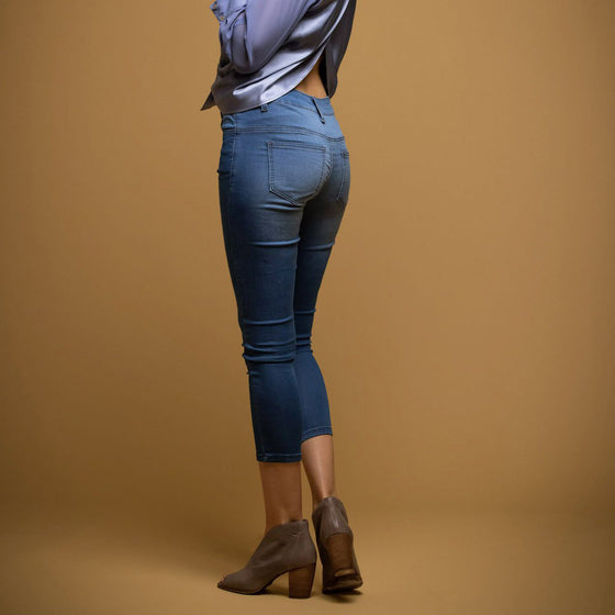 back view of model in the unreal jean by inlarkin showing the slimming fit with seam and back pocket detail
