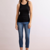 front view of model in the unreal jean by inlarkin showing the slimming fit with seam and zipper detail at the ankles 